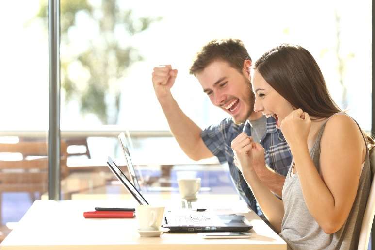 Young couple winning an online RV auction