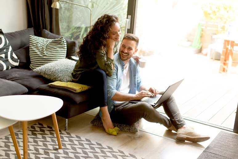 Couple looking for a sofa bed mattress online
