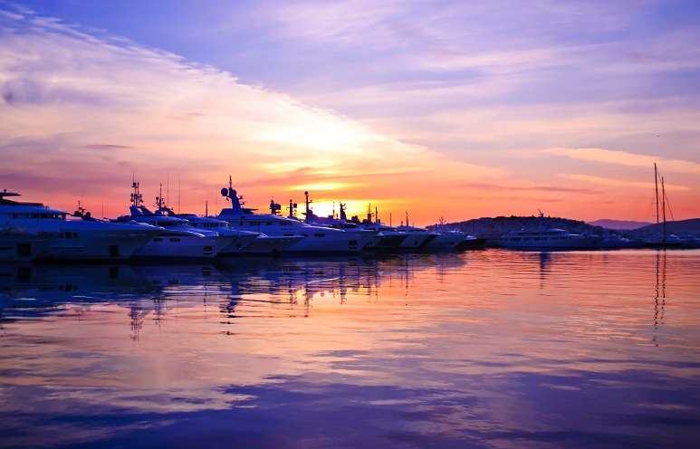 Sea Ray boats in the harbor at sunset
