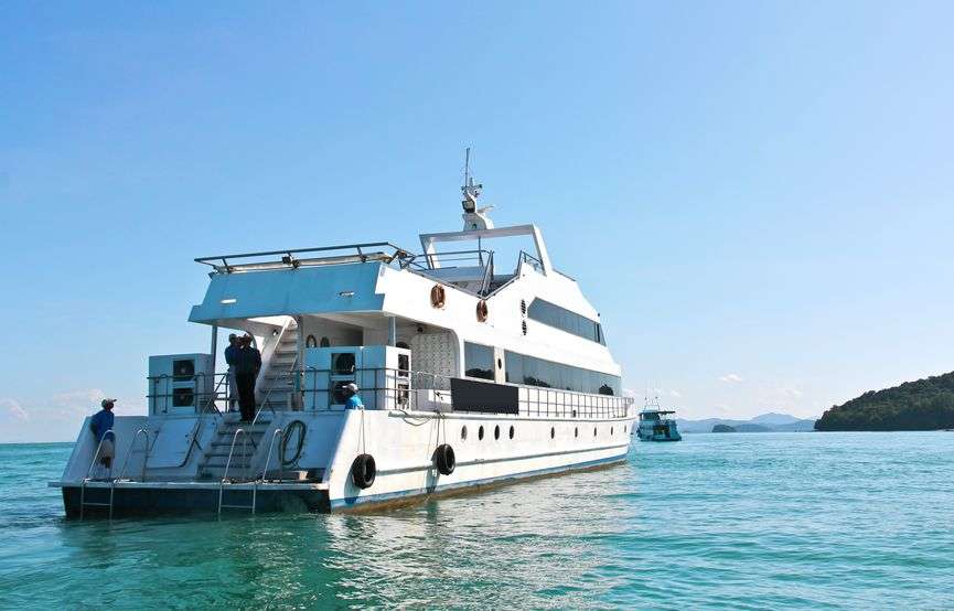 a large private yacht under way out at sea